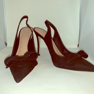 Black heels with bow detail. Worn once